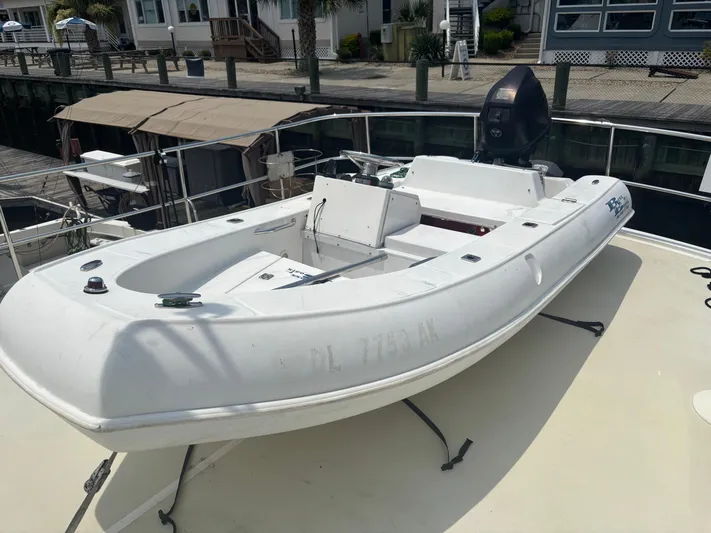 Almost Perfect Yacht Photos Pics 2006 Kadey-Krogen North Sea Widebody with small boat on deck, docked at marina.