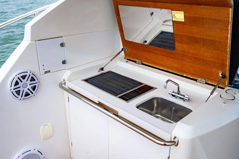 The Royal Blue Yacht Photos Pics Beneteau Gran Turismo 49 yacht kitchenette with sink and grill, 2015 model.