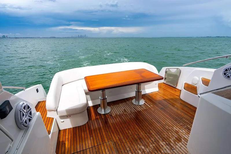 The Royal Blue Yacht Photos Pics Beneteau Gran Turismo 49 yacht deck with wooden table, 2015 model, ocean view.