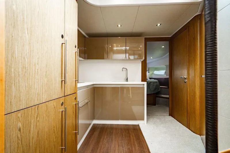 The Royal Blue Yacht Photos Pics Luxurious interior of 2015 Beneteau GRAN TURISMO 49 yacht kitchen area.