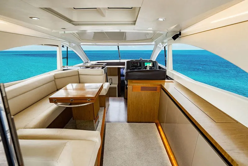 The Royal Blue Yacht Photos Pics Luxurious interior of 2015 Beneteau Gran Turismo 49 yacht with ocean view.