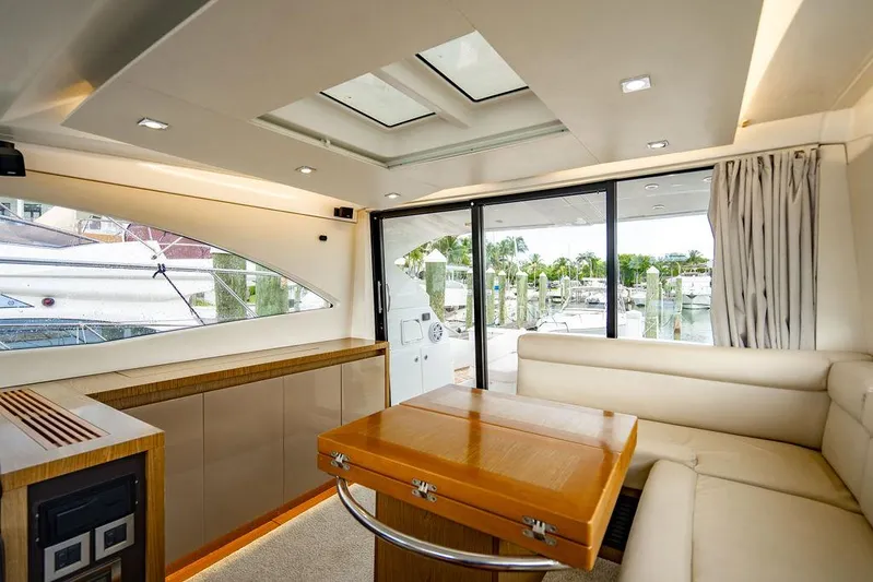 The Royal Blue Yacht Photos Pics Luxurious interior of 2015 Beneteau Gran Turismo 49 yacht with modern seating and large windows.