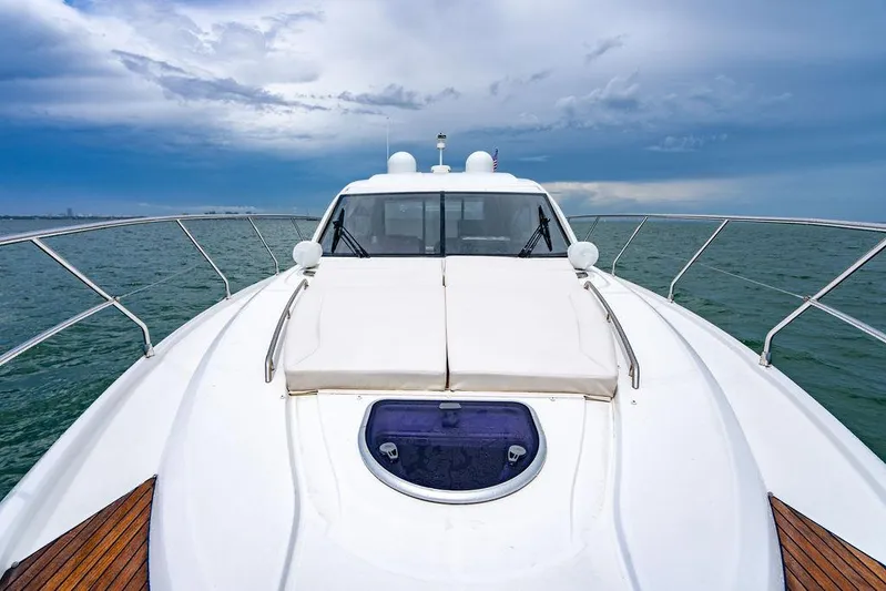 The Royal Blue Yacht Photos Pics 2015 Beneteau Gran Turismo 49 yacht on open water under cloudy sky.