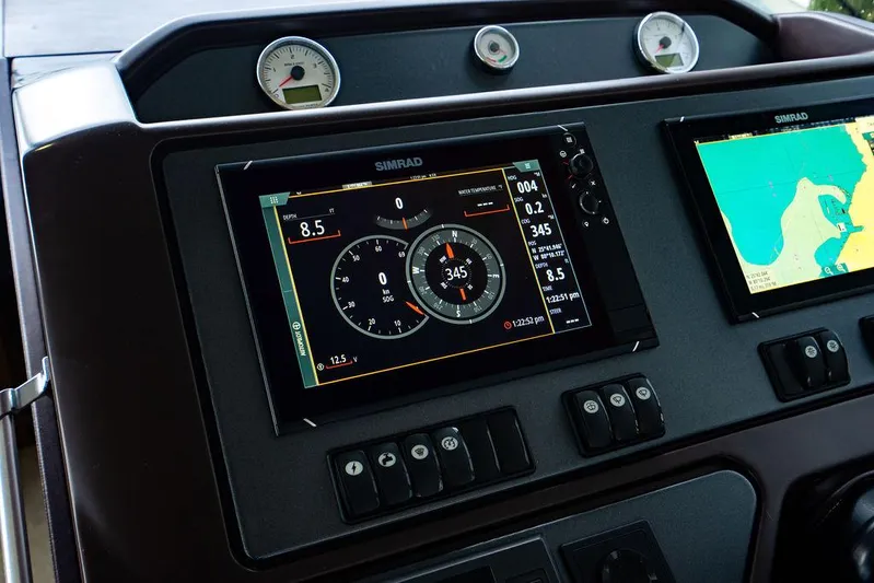 The Royal Blue Yacht Photos Pics Dashboard of 2015 Beneteau GRAN TURISMO 49 with navigation and control displays.