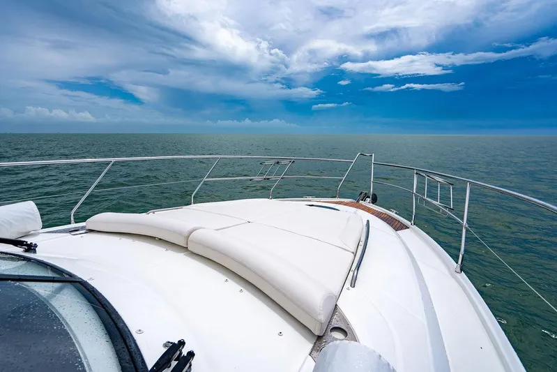 The Royal Blue Yacht Photos Pics Beneteau GRAN TURISMO 49 yacht deck, 2015 model, cruising on open sea under blue sky.