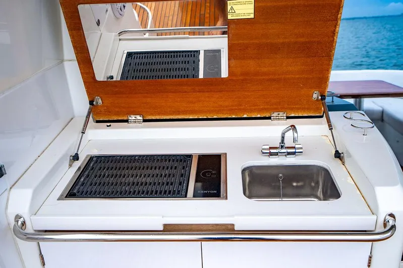 The Royal Blue Yacht Photos Pics Outdoor kitchen on 2015 Beneteau GRAN TURISMO 49 yacht with grill and sink.