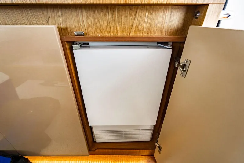 The Royal Blue Yacht Photos Pics Built-in refrigerator in 2015 Beneteau GRAN TURISMO 49 yacht interior.