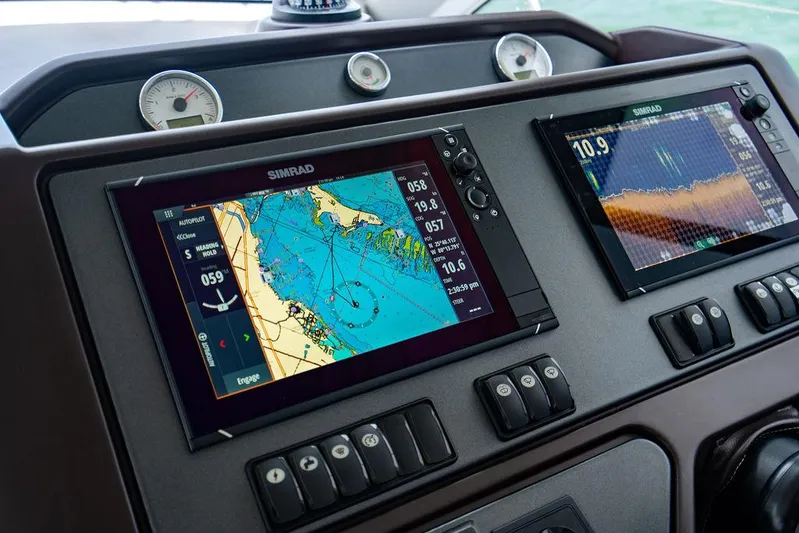 The Royal Blue Yacht Photos Pics Beneteau GRAN TURISMO 49 dashboard with navigation screens, 2015 model.