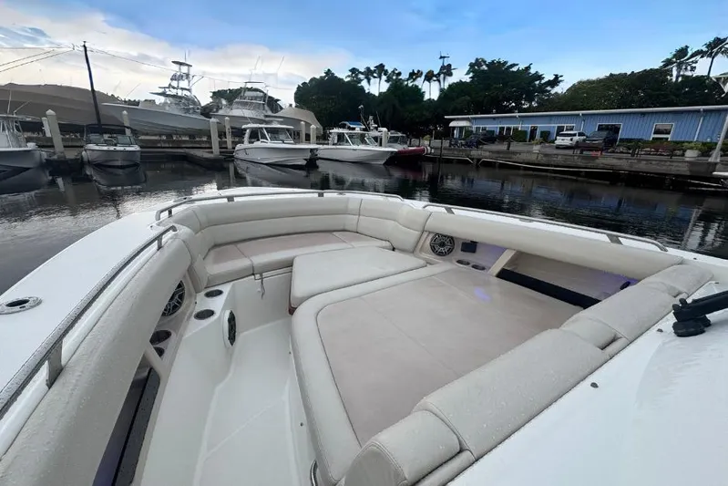  Yacht Photos Pics 2022 Boston Whaler 350 Realm boat interior with spacious seating at marina.