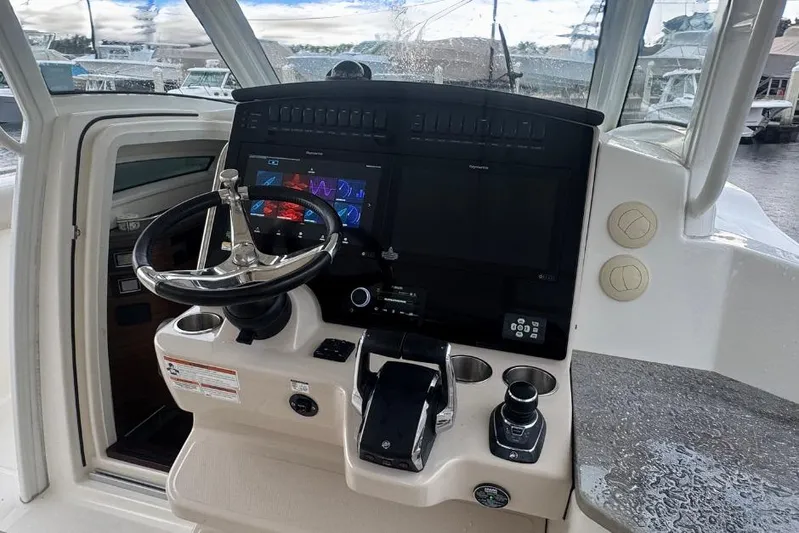  Yacht Photos Pics 2022 Boston Whaler 350 Realm helm with modern controls and navigation display.