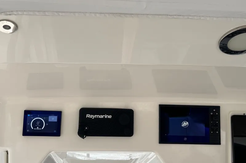  Yacht Photos Pics 2022 Boston Whaler 350 Realm dashboard with Raymarine navigation system.