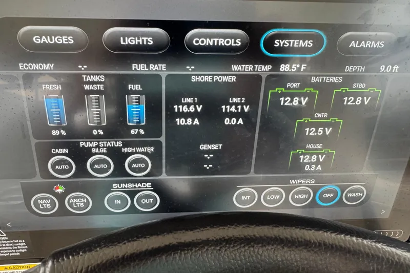  Yacht Photos Pics Dashboard of a 2022 Boston Whaler 350 Realm showing system gauges and battery status.