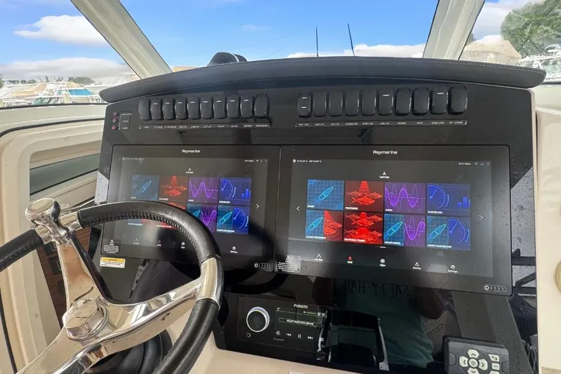 Yacht Photos Pics Control panel of 2022 Boston Whaler 350 Realm with advanced navigation displays.