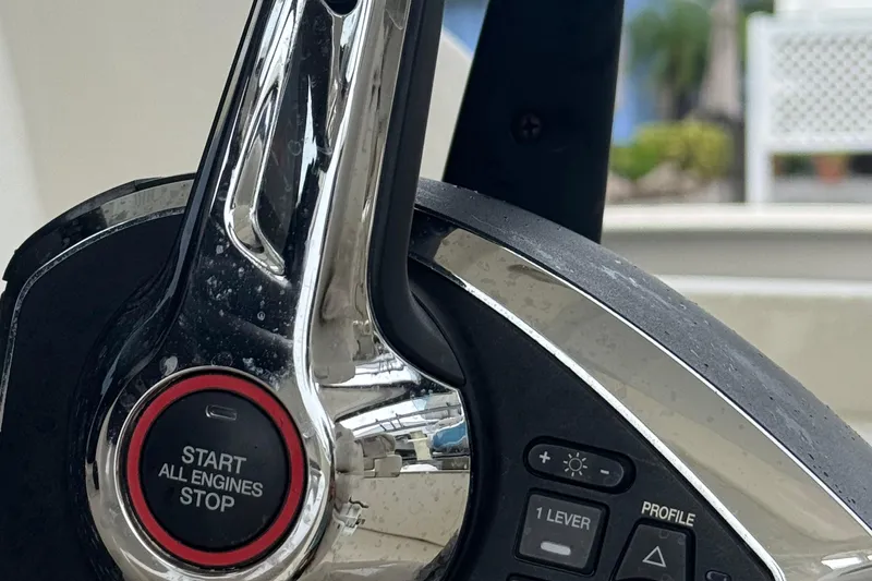  Yacht Photos Pics Close-up of 2022 Boston Whaler 350 Realm engine start-stop button and controls.