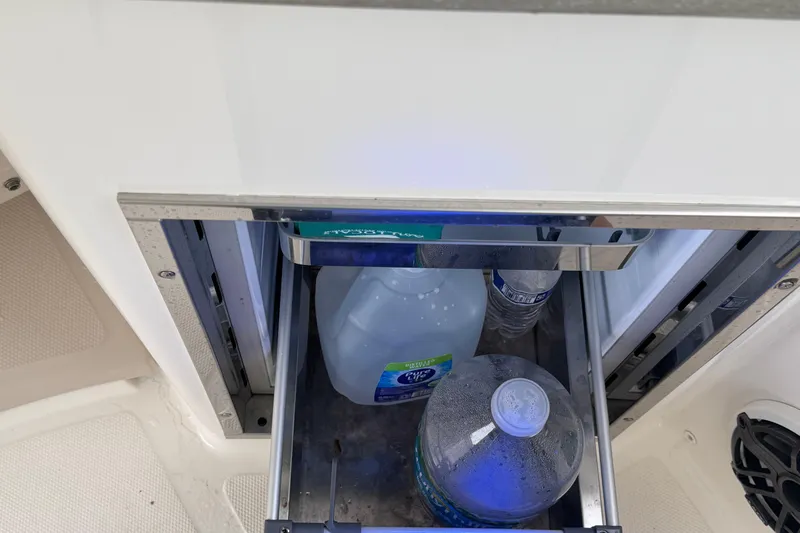 Yacht Photos Pics Built-in cooler with water bottles on a 2022 Boston Whaler 350 Realm boat.
