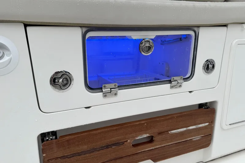  Yacht Photos Pics 2022 Boston Whaler 350 Realm boat compartment with blue interior lighting.