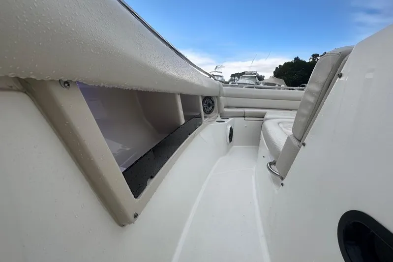  Yacht Photos Pics 2022 Boston Whaler 350 Realm interior with seating and storage compartments.