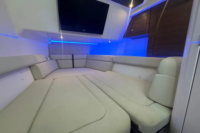  Yacht Photos Pics Luxurious interior of 2022 Boston Whaler 350 Realm with plush seating and ambient lighting.