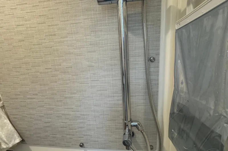  Yacht Photos Pics Shower area in 2022 Boston Whaler 350 Realm boat, featuring modern fixtures.