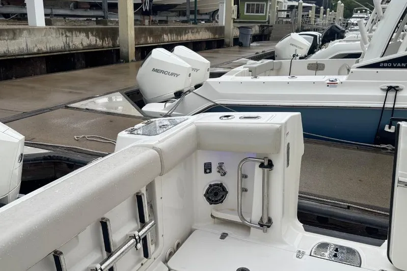  Yacht Photos Pics 2022 Boston Whaler 350 Realm docked, featuring Mercury outboard engines.