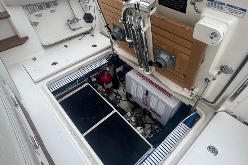  Yacht Photos Pics 2022 Boston Whaler 350 Realm engine compartment with equipment and storage features.