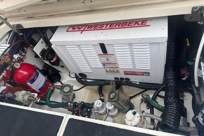 Yacht Photos Pics Engine compartment of a 2022 Boston Whaler 350 Realm with Westerbeke generator and fire extinguisher.