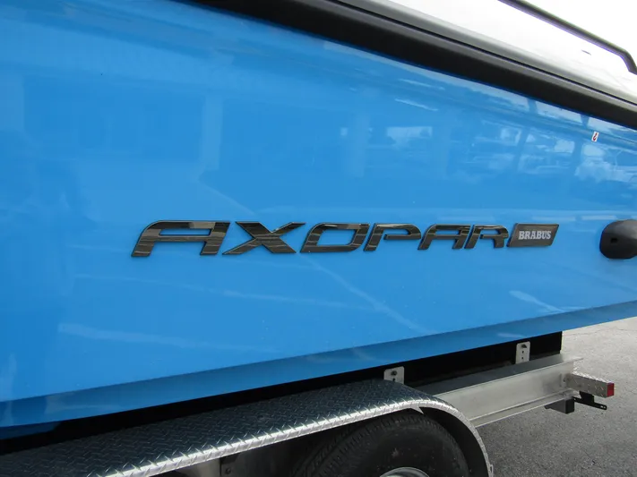  Yacht Photos Pics 2024 Axopar 37 Sun Top boat, blue hull, on trailer.