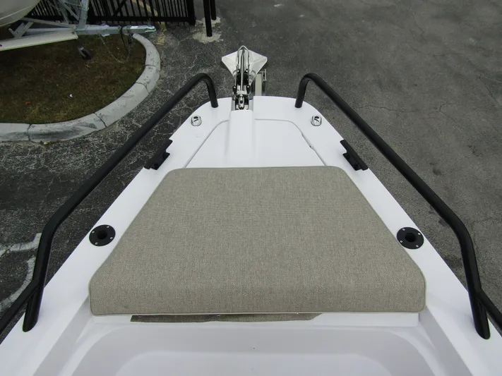  Yacht Photos Pics 2024 Axopar 37 Sun Top bow with cushioned seating and sleek railings.