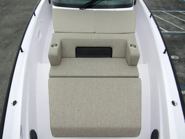  Yacht Photos Pics 2024 Axopar 37 Sun Top boat with beige cushioned seating and cup holders.