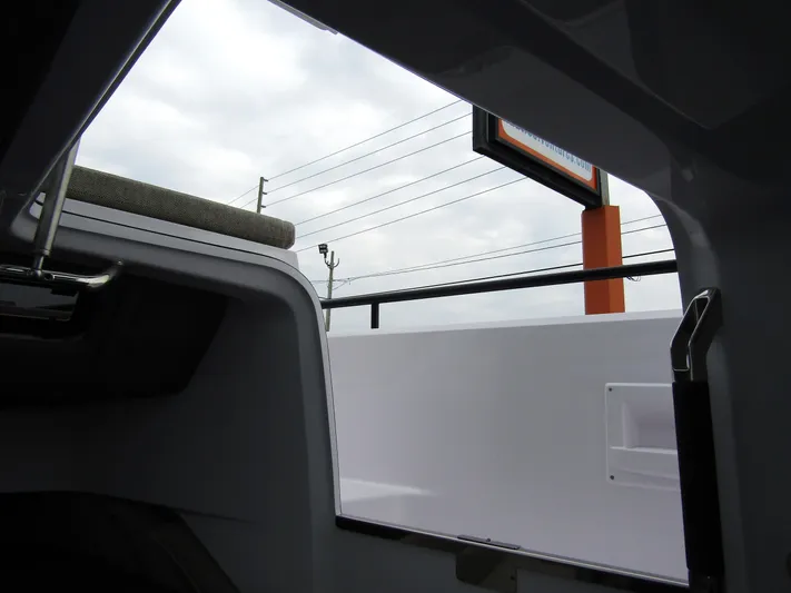  Yacht Photos Pics View from inside a 2024 Axopar 37 Sun Top boat, showing exterior details.