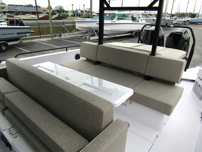  Yacht Photos Pics 2024 Axopar 37 Sun Top boat with spacious seating and sleek design.