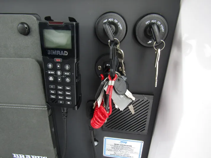  Yacht Photos Pics Control panel with keys and SIMRAD device on 2024 Axopar 37 Sun Top boat.