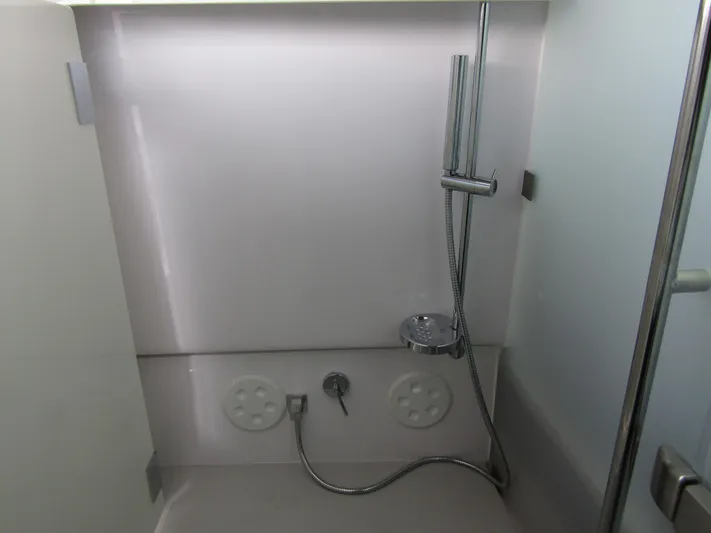  Yacht Photos Pics 2024 Axopar 37 Sun Top shower area with modern fixtures and sleek design.