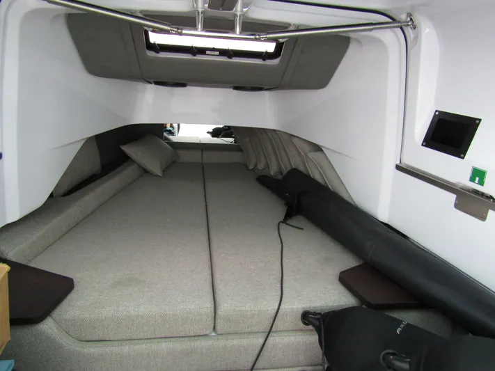  Yacht Photos Pics 2024 Axopar 37 Sun Top cabin interior with spacious bed and modern design.