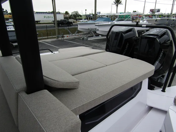  Yacht Photos Pics 2024 Axopar 37 Sun Top with cushioned seating and dual Mercury outboard engines.