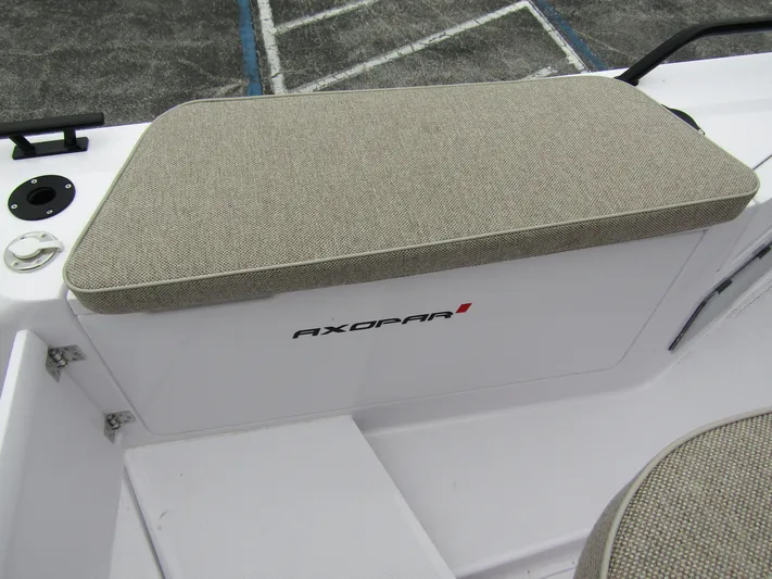  Yacht Photos Pics 2024 Axopar 37 Sun Top boat seating detail with beige cushion.