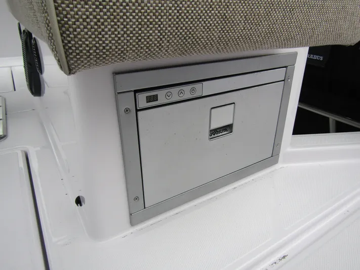  Yacht Photos Pics 2024 Axopar 37 Sun Top boat interior with built-in storage compartment.