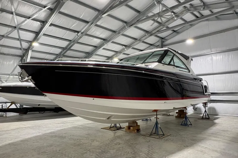  Yacht Photos Pics 2023 Formula 400 Super Sport Crossover boat in a spacious indoor storage facility.