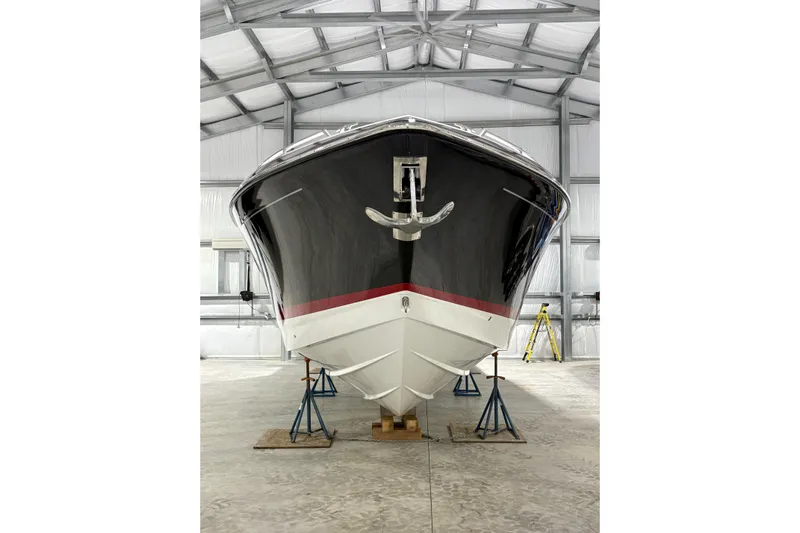  Yacht Photos Pics 2023 Formula 400 Super Sport Crossover boat in storage, front view.