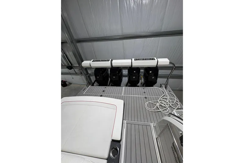  Yacht Photos Pics 2023 Formula 400 Super Sport Crossover boat with triple outboard engines in a garage.