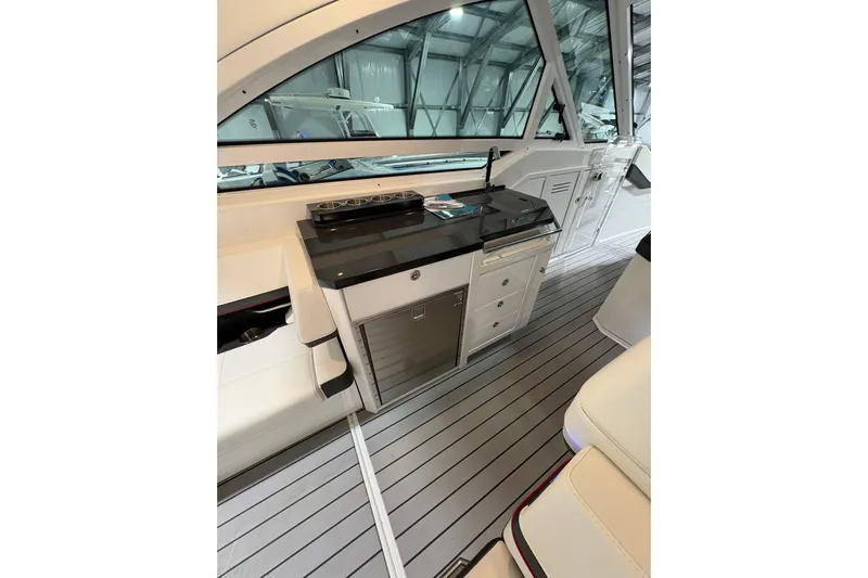  Yacht Photos Pics 2023 Formula 400 Super Sport Crossover interior with sleek kitchenette and modern design.