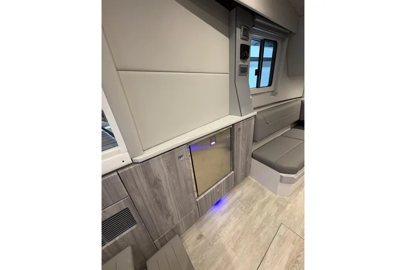  Yacht Photos Pics 2023 Formula 400 Super Sport Crossover interior with modern seating and cabinetry.