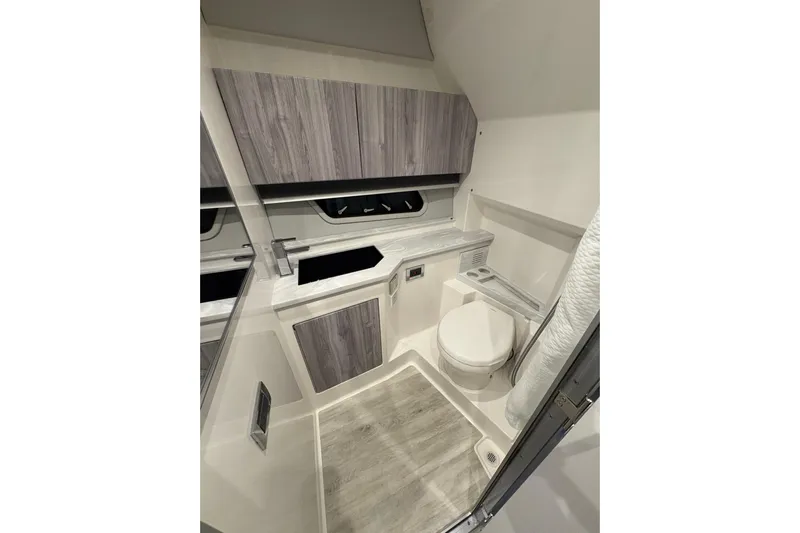  Yacht Photos Pics 2023 Formula 400 Super Sport Crossover bathroom with modern fixtures and wood accents.