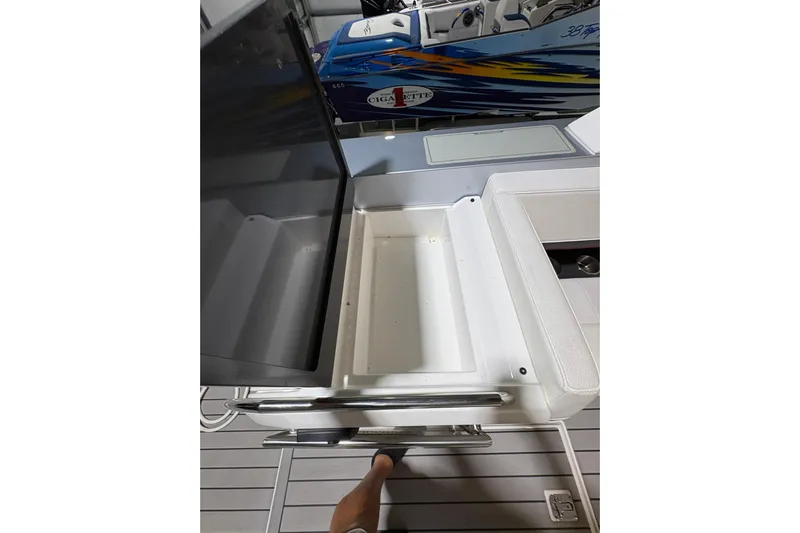  Yacht Photos Pics 2023 Formula 400 Super Sport Crossover boat interior with open storage compartment.