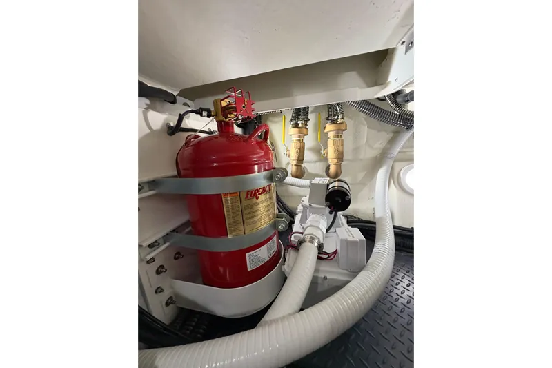  Yacht Photos Pics Engine room of 2023 Formula 400 Super Sport Crossover with fire extinguisher and plumbing.