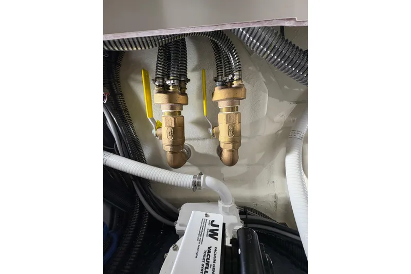  Yacht Photos Pics Engine room of 2023 Formula 400 Super Sport Crossover with brass valves and hoses.