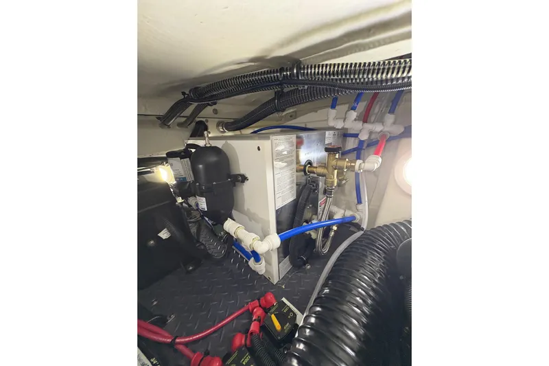  Yacht Photos Pics Engine compartment of 2023 Formula 400 Super Sport Crossover with wiring and plumbing.