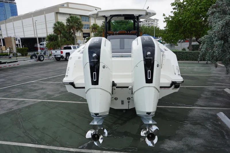Bwcp0430a424 Yacht Photos Pics 2024 Boston Whaler 380 Outrage with twin outboard engines in a parking lot.