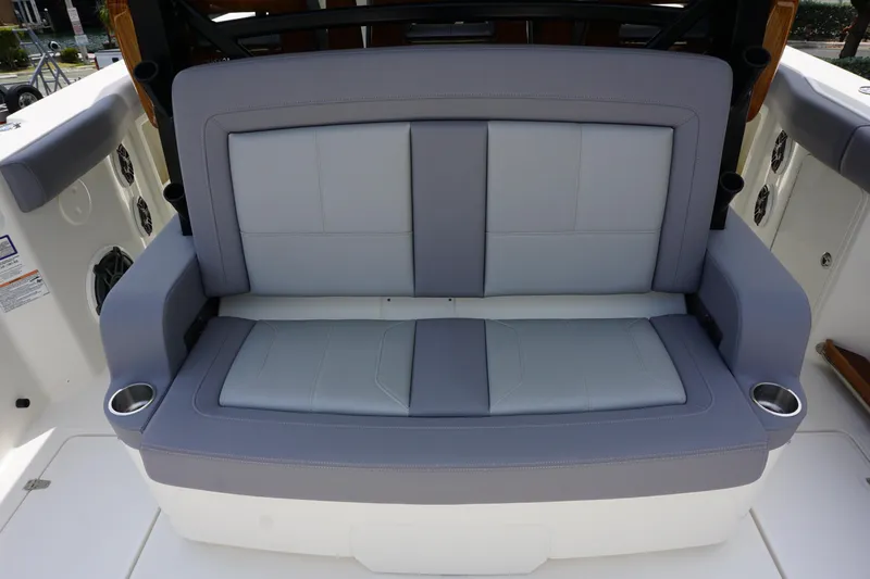 Bwcp0430a424 Yacht Photos Pics Boston Whaler 380 Outrage 2024 boat's cushioned rear seating with cup holders.