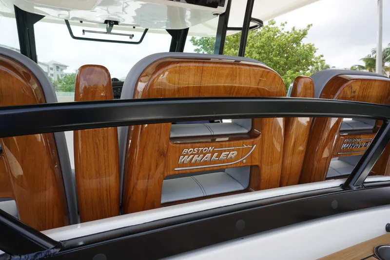 Bwcp0430a424 Yacht Photos Pics 2024 Boston Whaler 380 Outrage boat with polished wooden seats and sleek design.